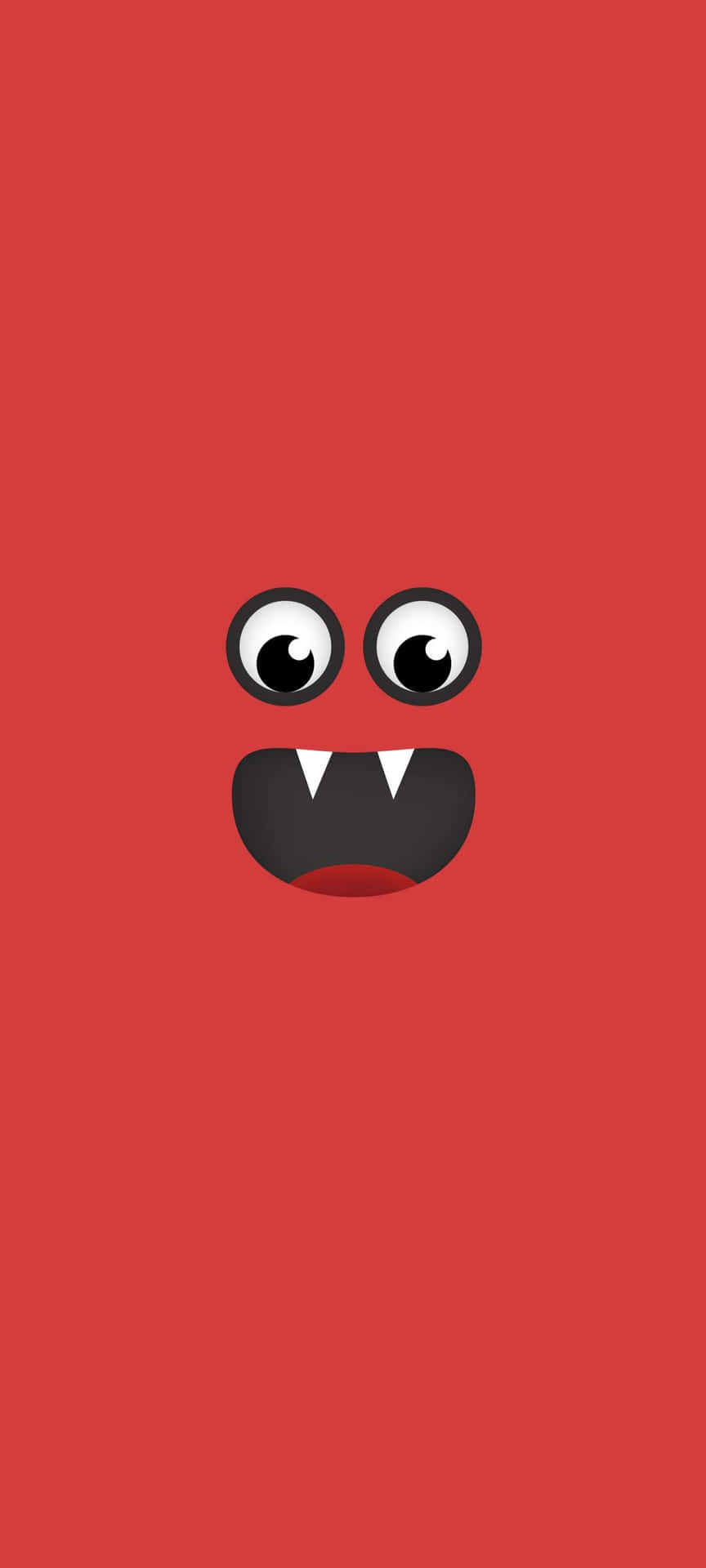 A Red Monster Face With Black Eyes