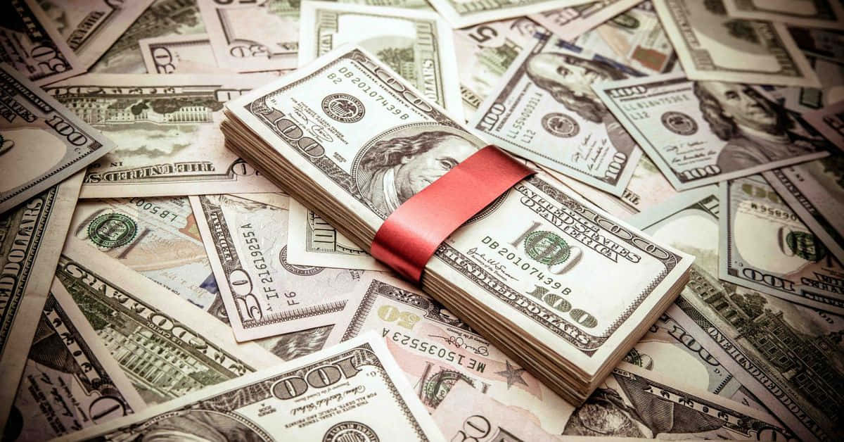 A Red Ribbon Is Tied Around A Pile Of Money Background