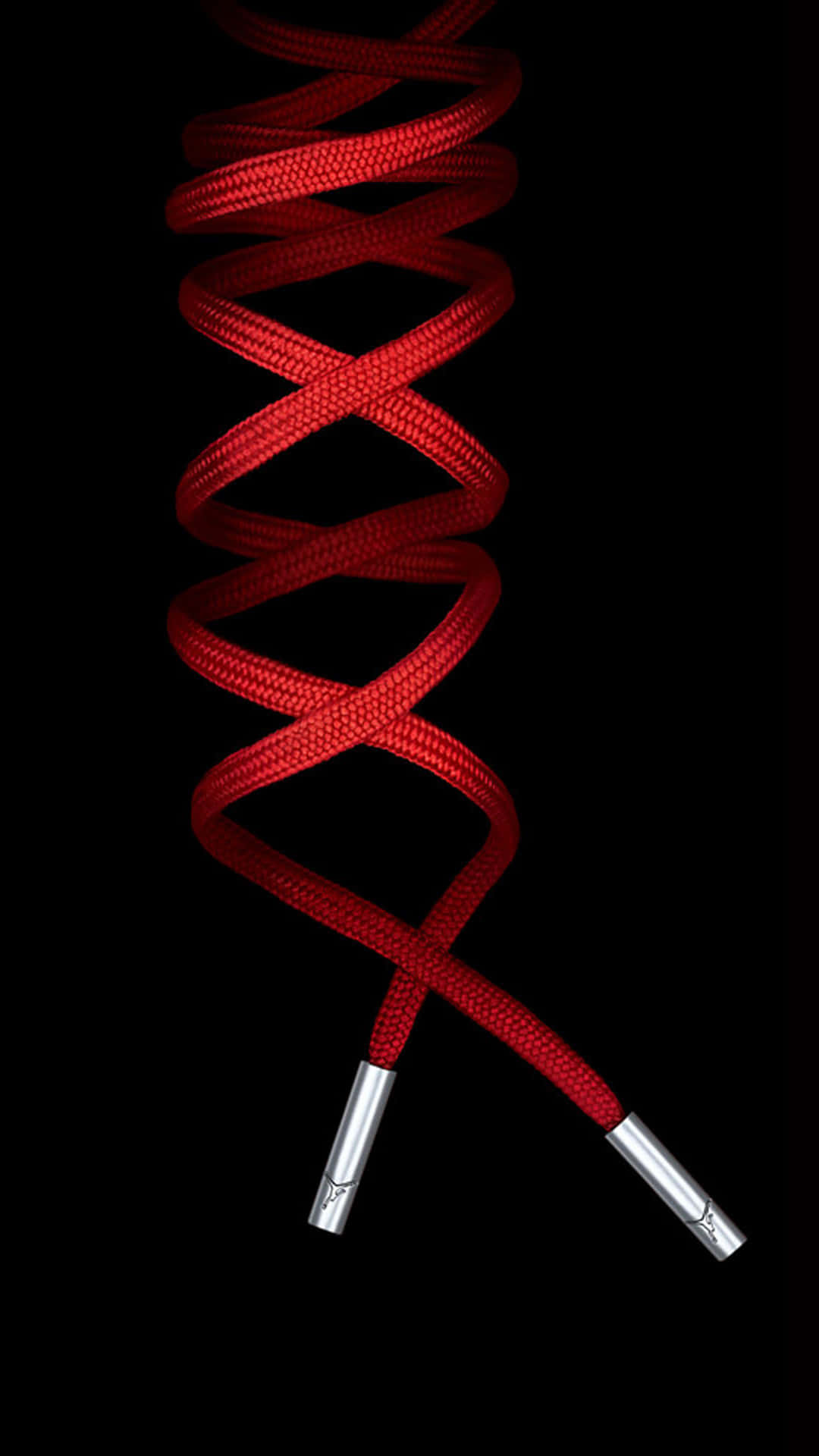 A Red Shoelace With A Silver Ring On It Background