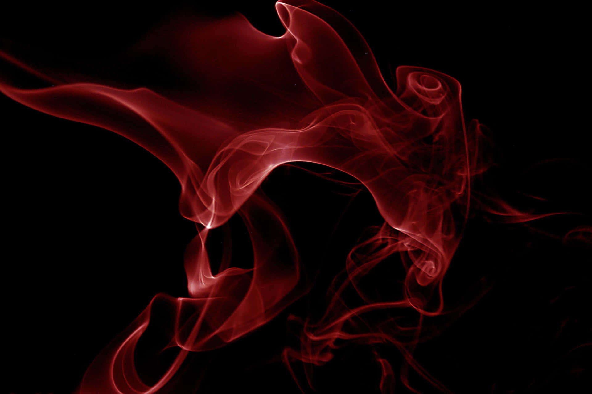 A Red Smoke On A Black Background Background