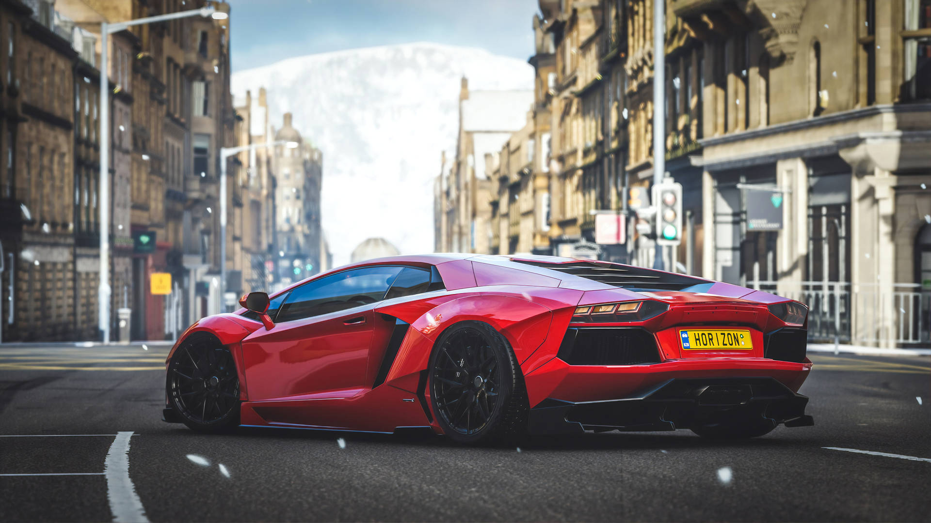 A Red Sports Car Driving Down A City Street Background