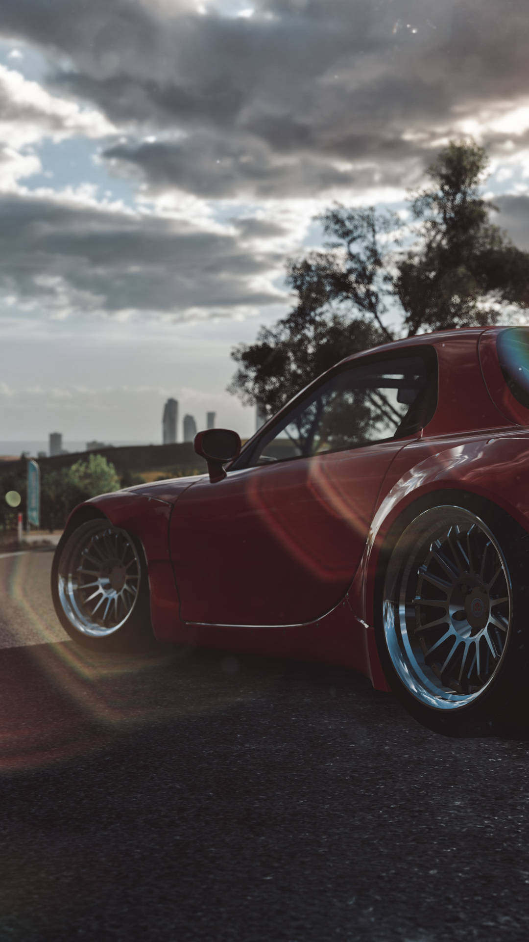 A Red Sports Car Is Parked In The Street Background