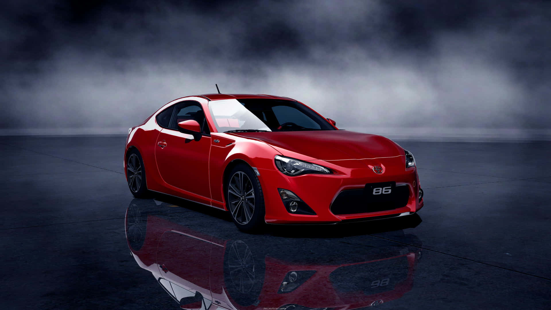 A Red Sports Car Is Shown In A Dark Room Background