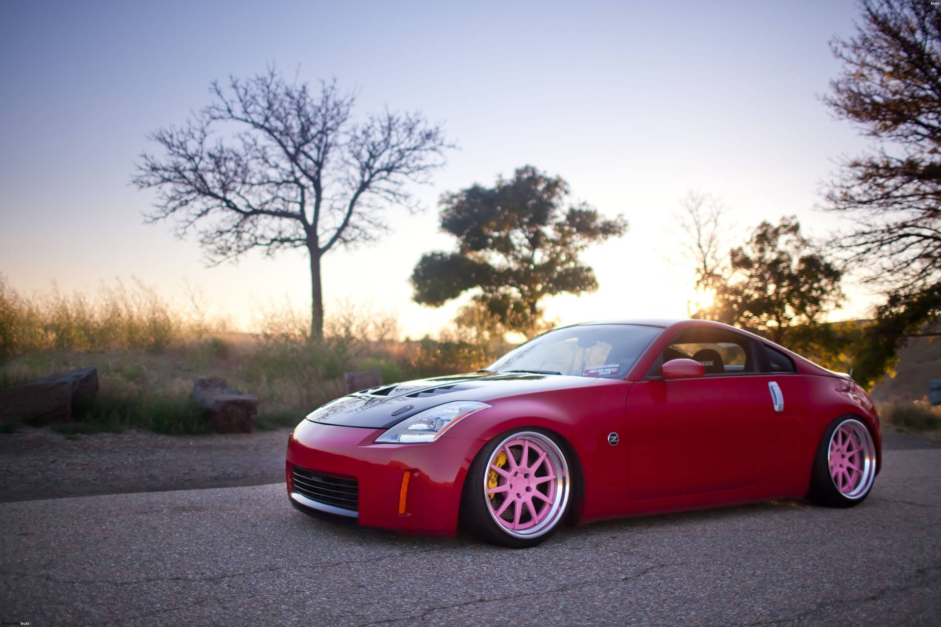 A Red Sports Car Parked In The Middle Of A Field Background