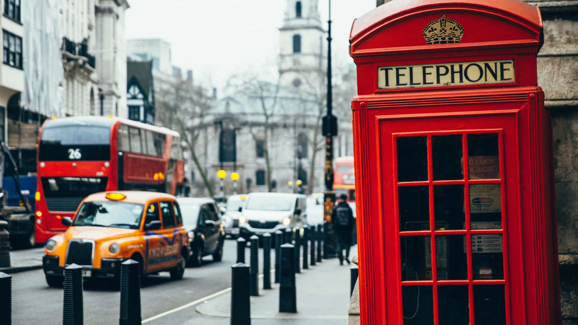 A Red Telephone Booth On A Street Background