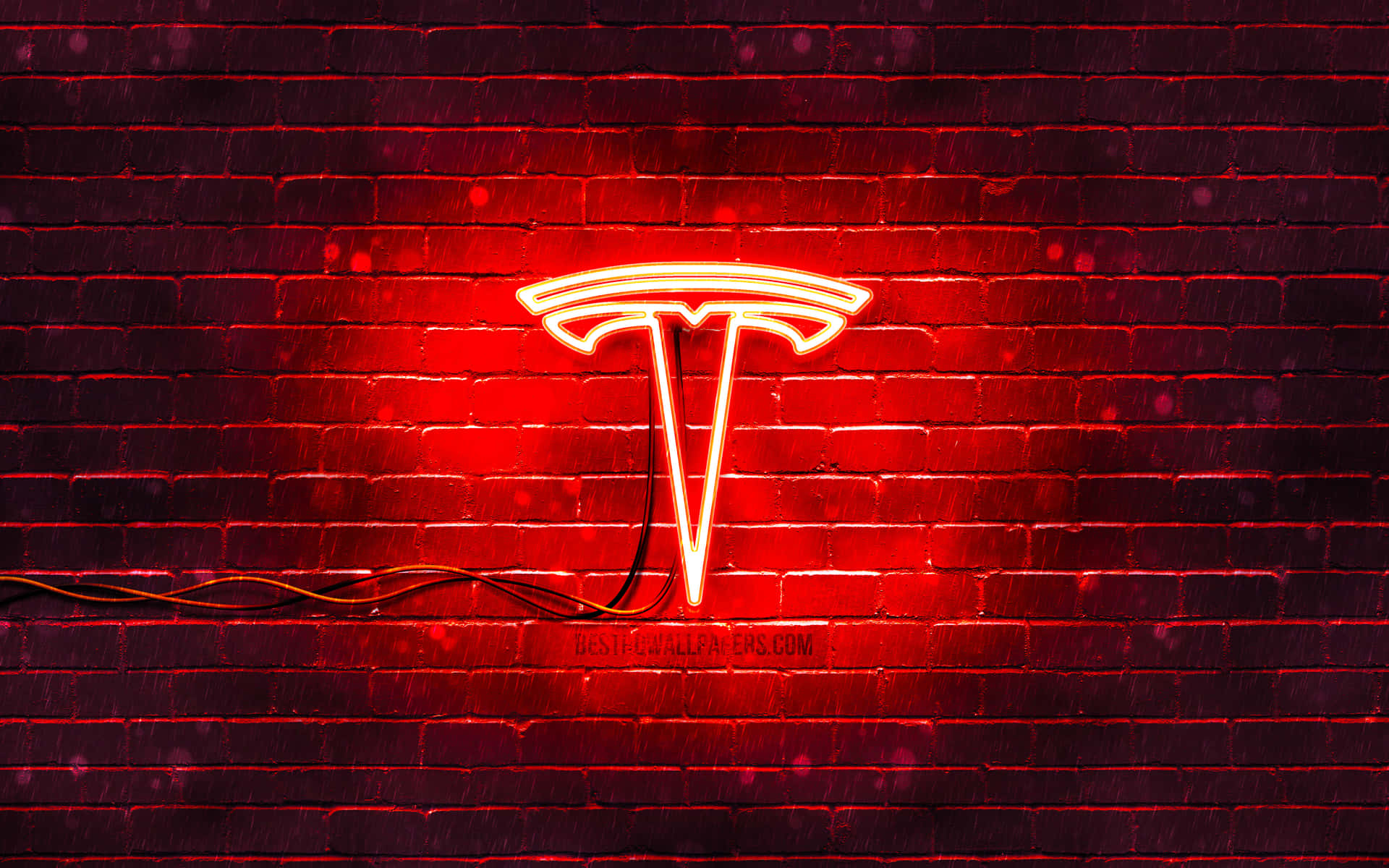 A Red Tesla Sign On A Brick Wall Background