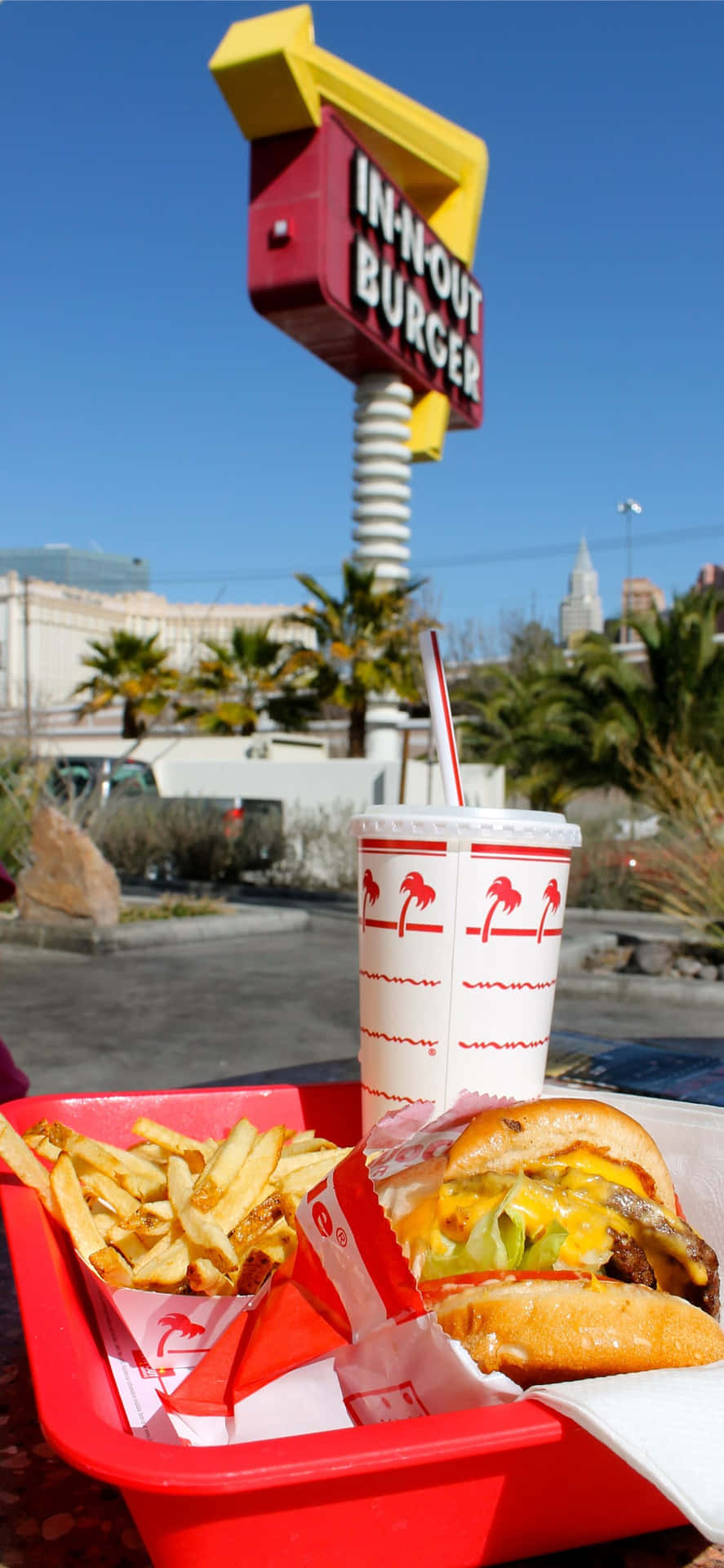 A Red Tray With A Hamburger And Fries Background