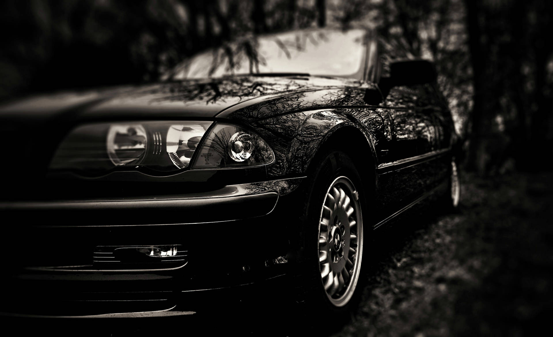 A Reflecive Brand-new Black Car Background