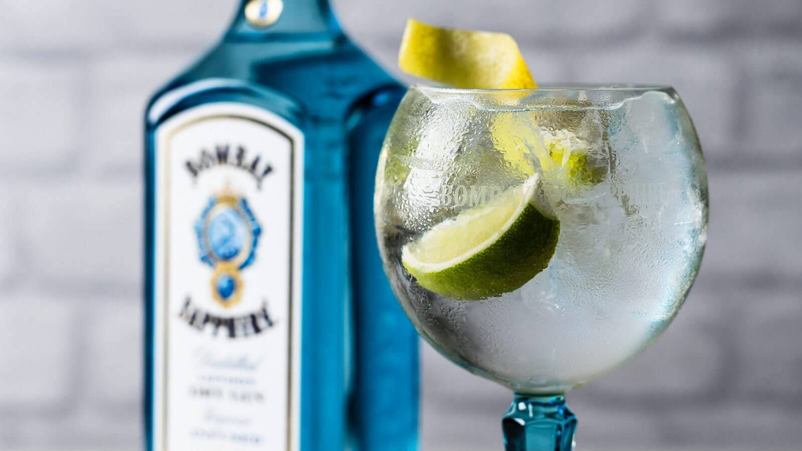 A Refreshing Lime Infused Bombay Wine In Glass. Background