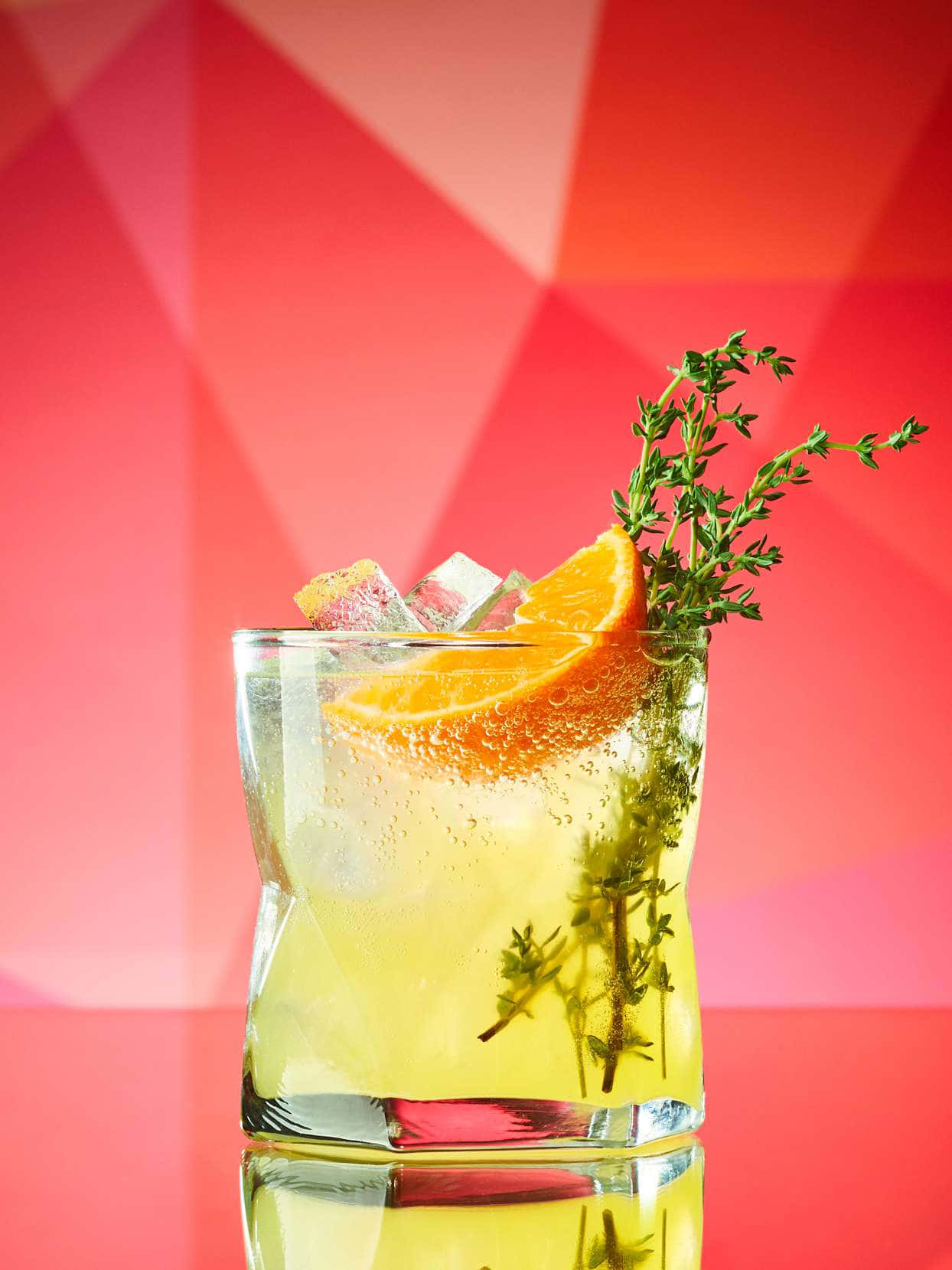 A Refreshing Orange Thyme Cocktail Background