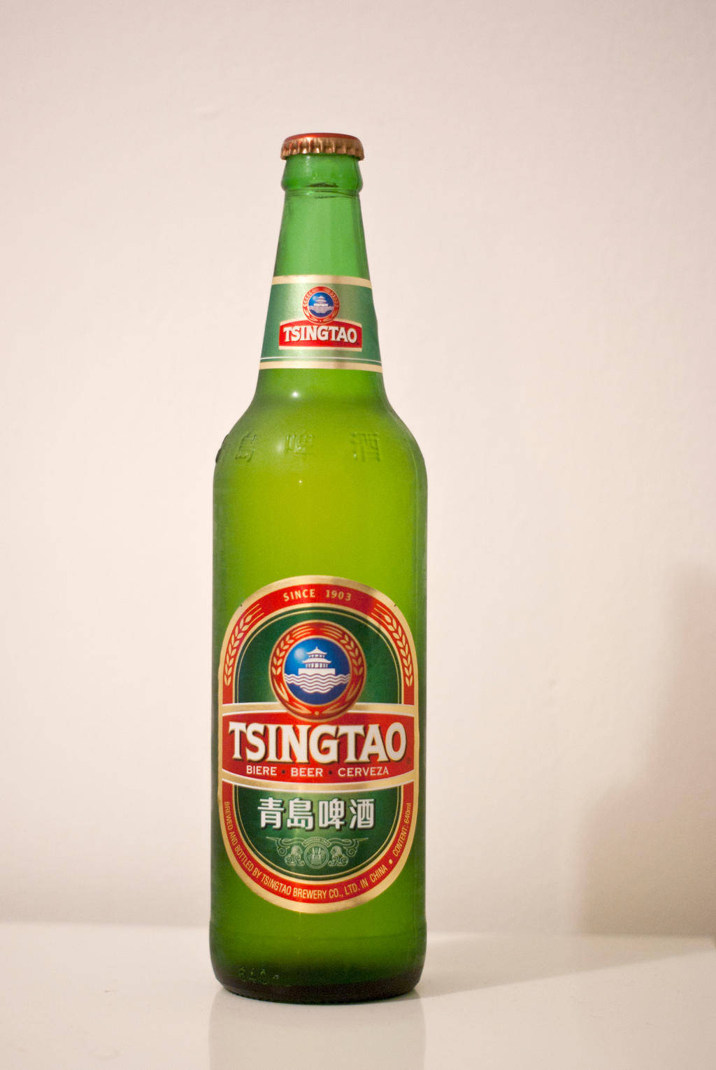 A Refreshing Taste Of Quality - Tsingtao Light Lager Beer Background