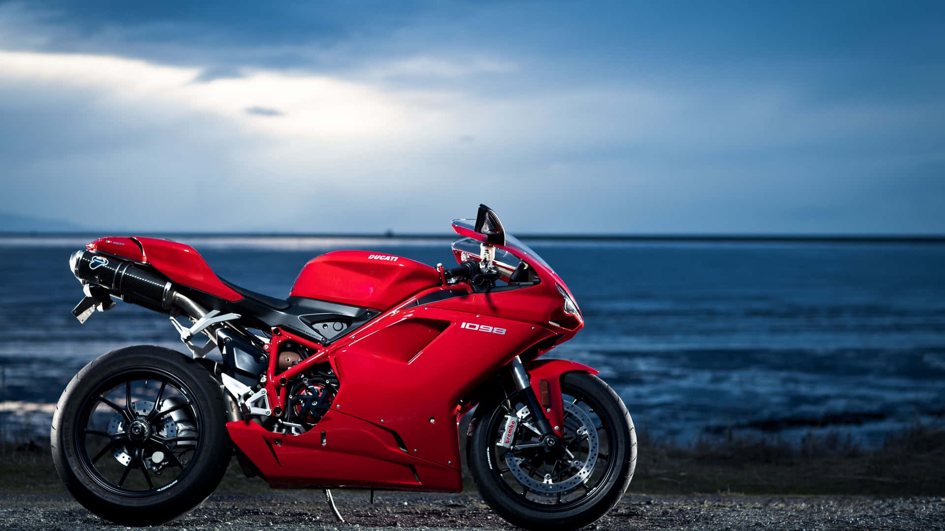 A Rider Takes An Exhilarating Spin Down A Mountainous Road In The New Bikes 4k. Background