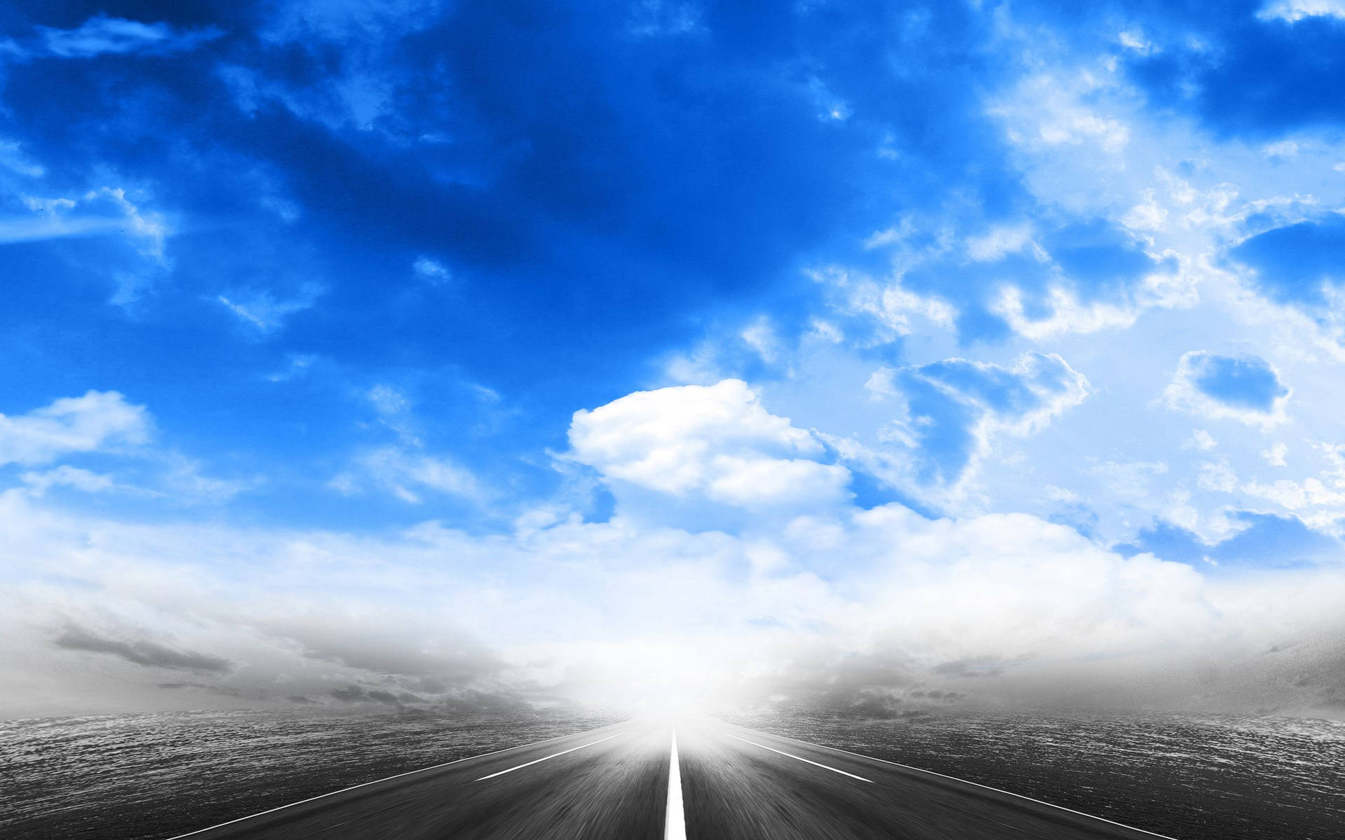 A Road With Clouds In The Sky Background