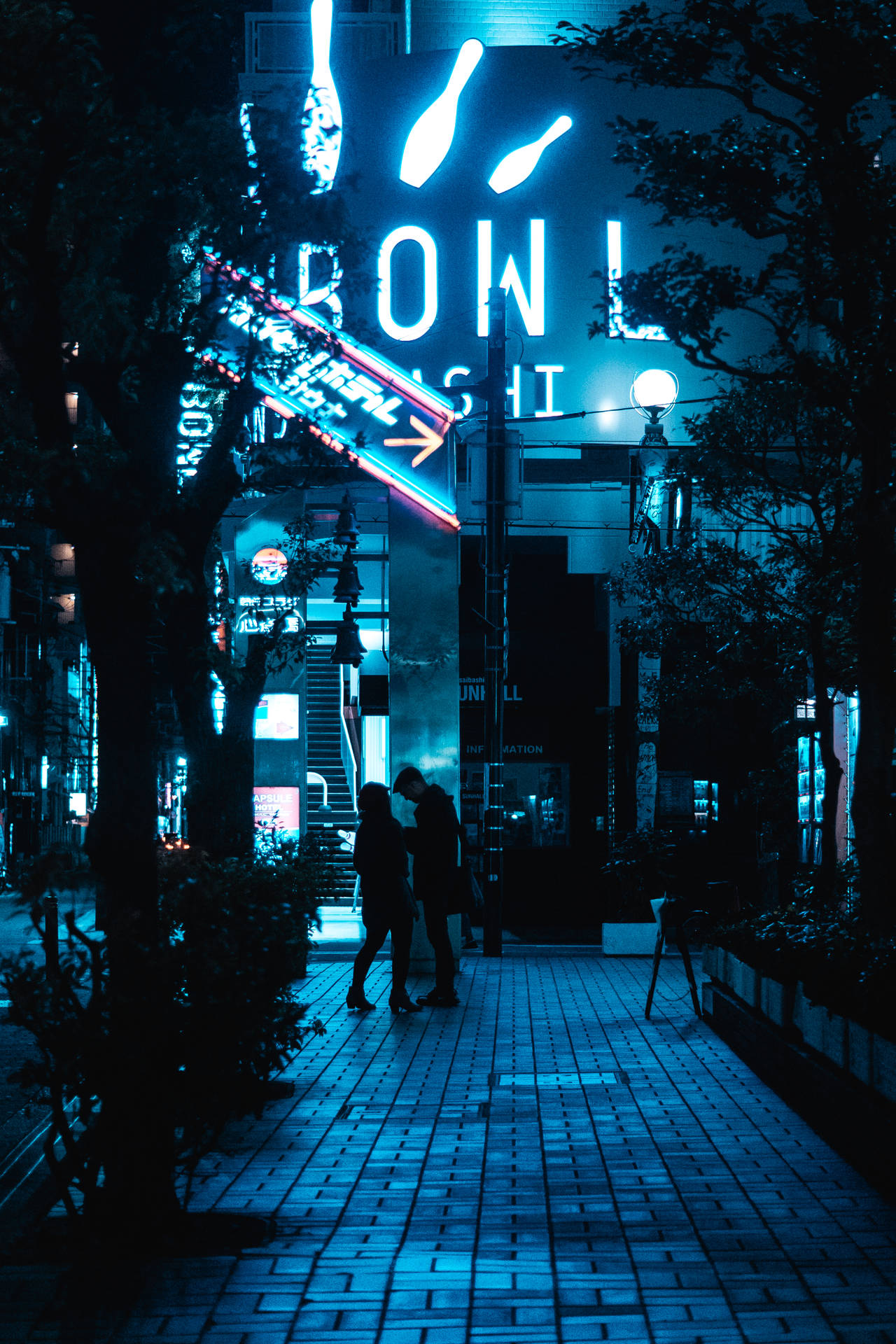 A Romantic Couple In The Glowing Blue City Background