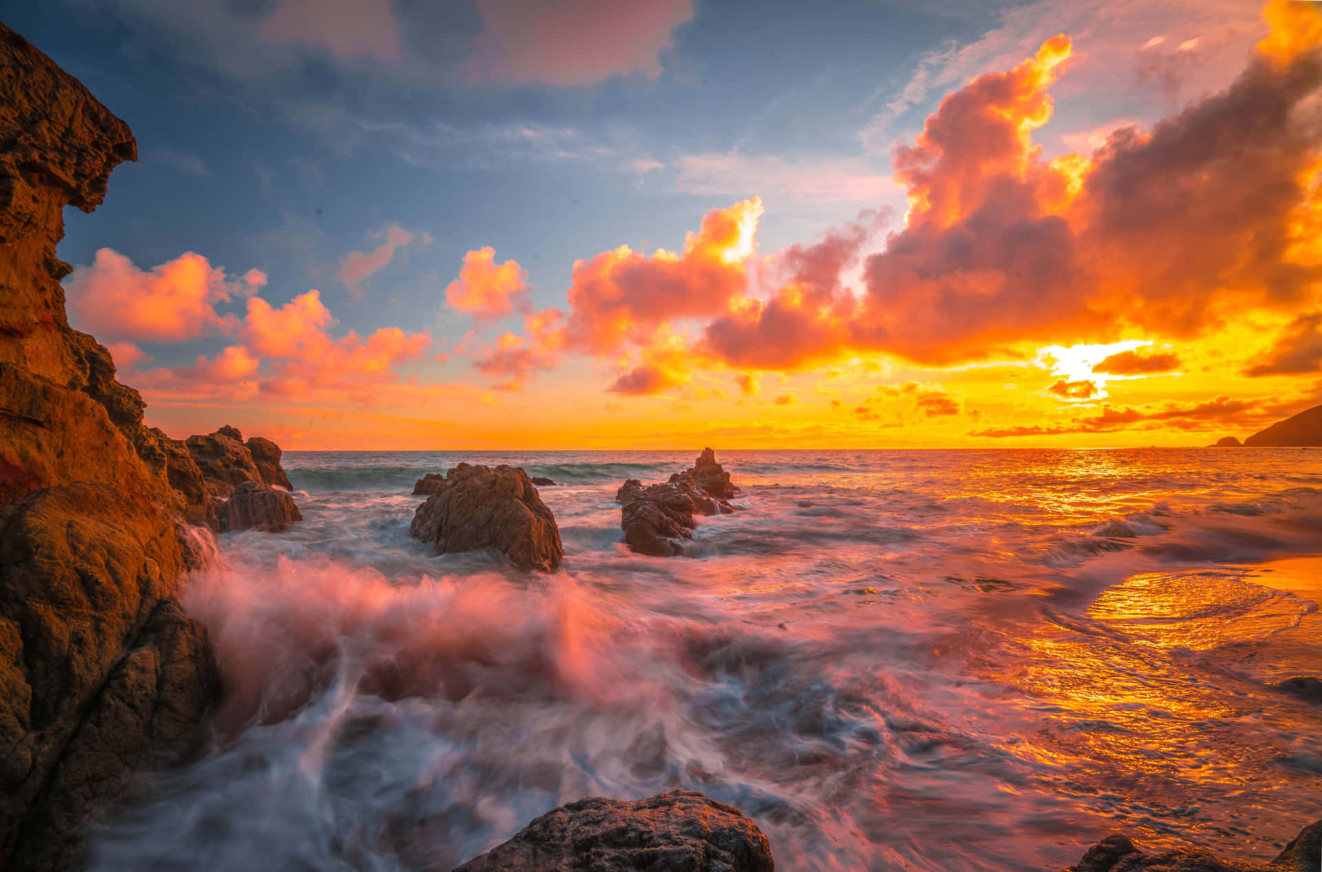 A Romantic Malibu Beach Sunrise Background