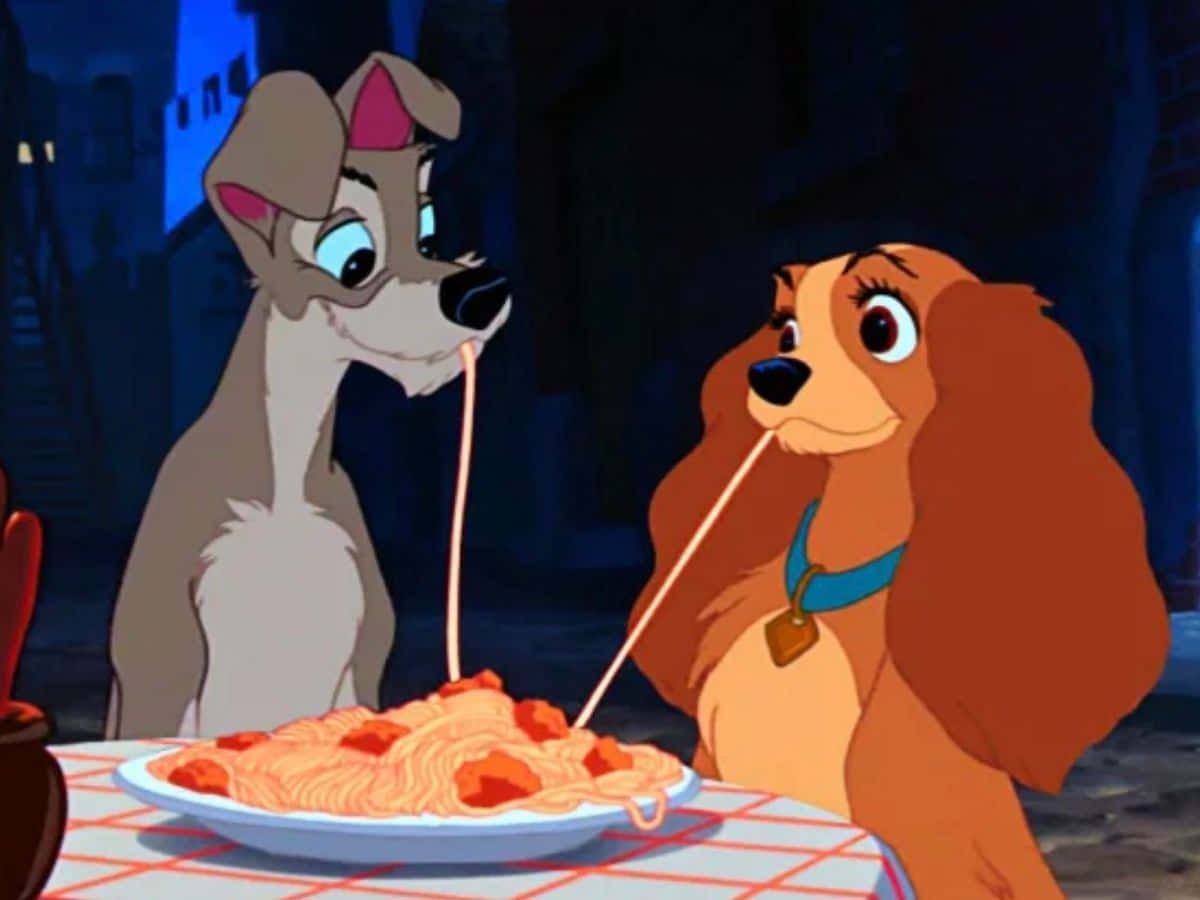 A Romantic Moment Between Lady And The Tramp Under The Moonlit Sky Background