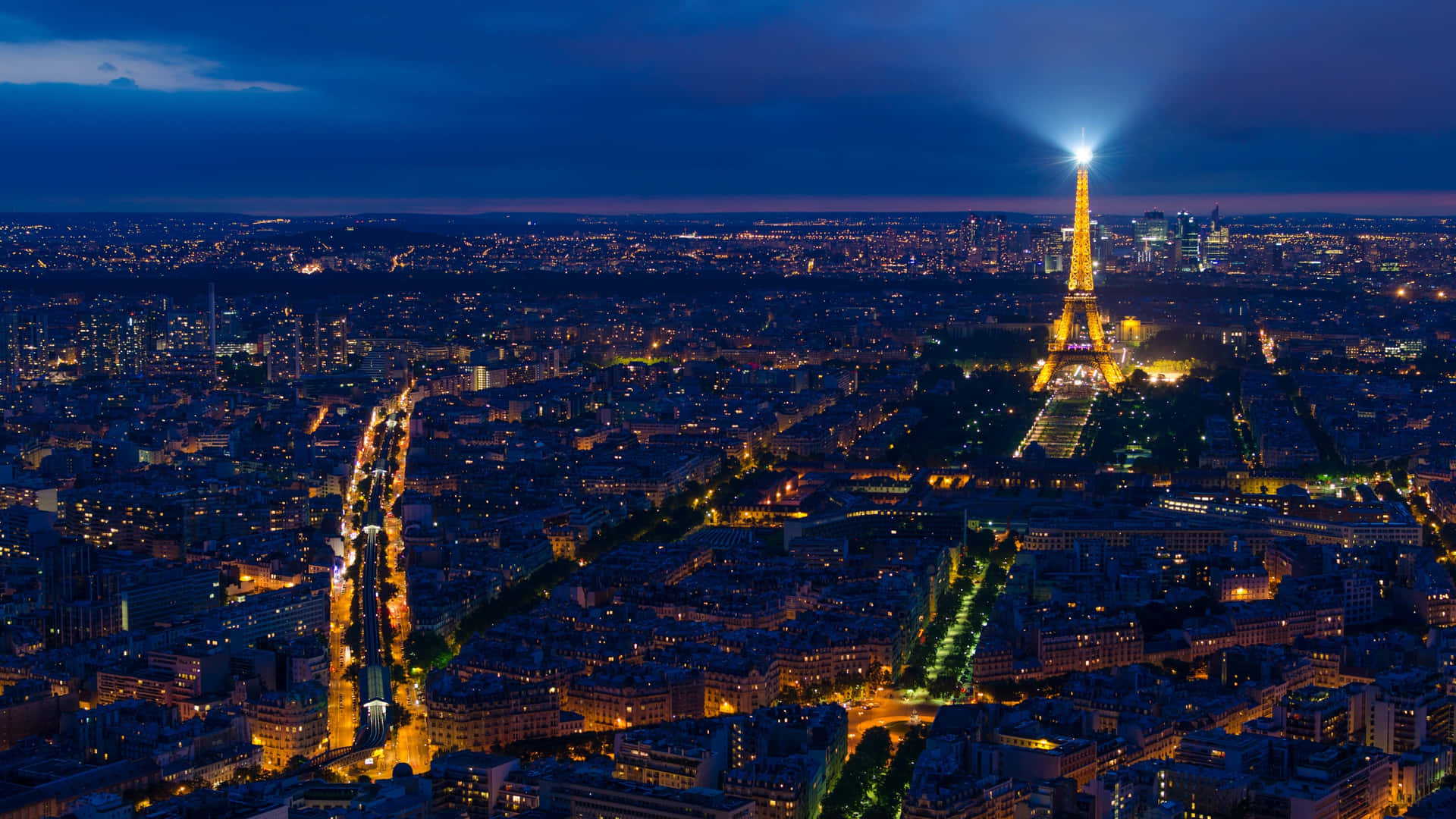A Romantic View Of Paris At Night Background