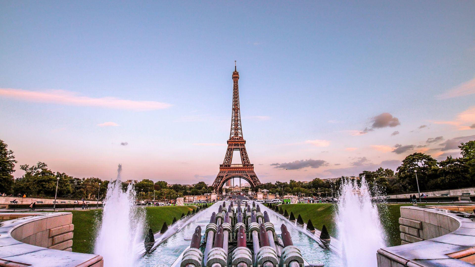 A Romantic View Of The Iconic Eiffel Tower, Sparkling In The Lights Of Paris. Background