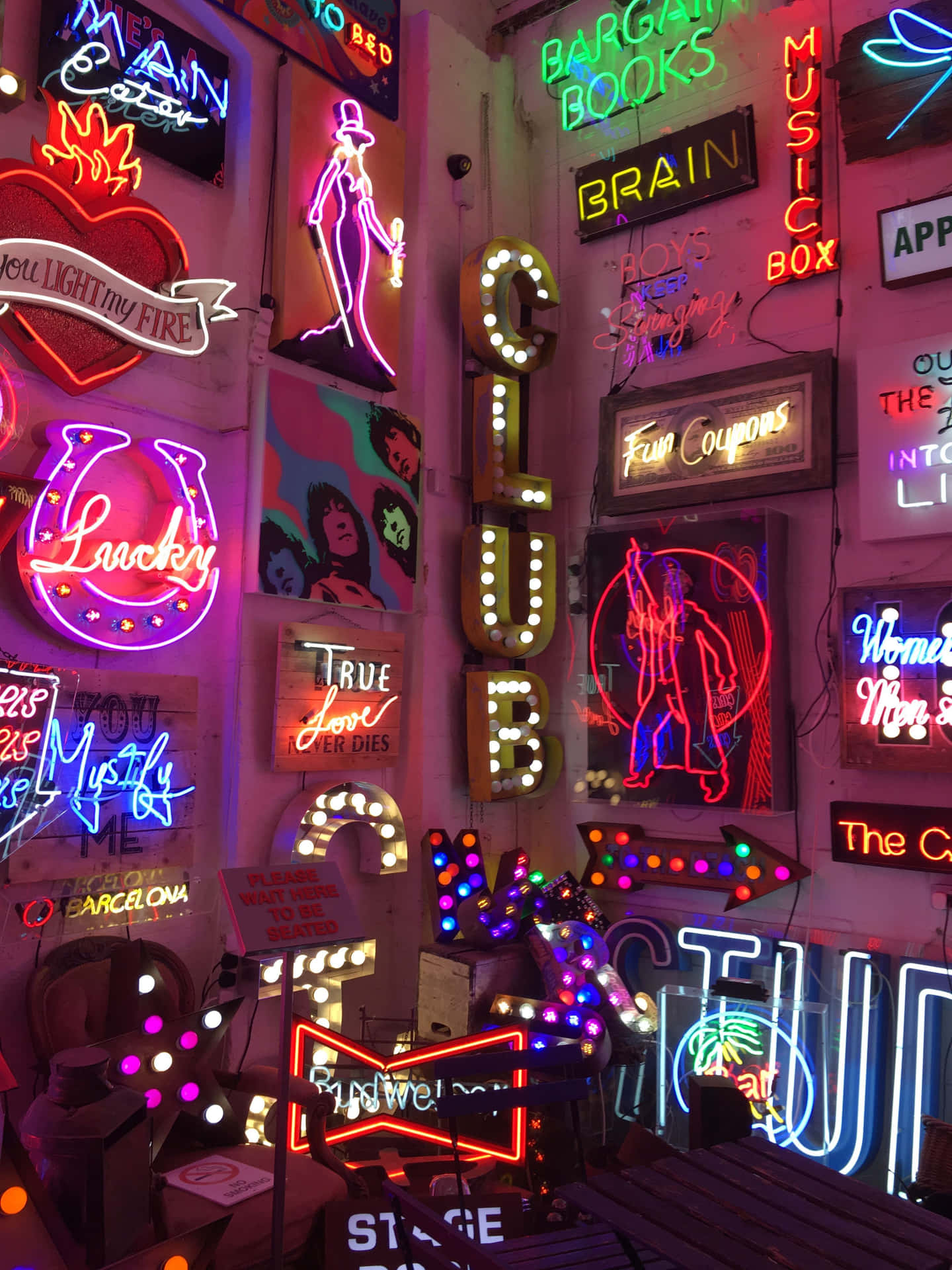 A Room Full Of Neon Signs And Other Items