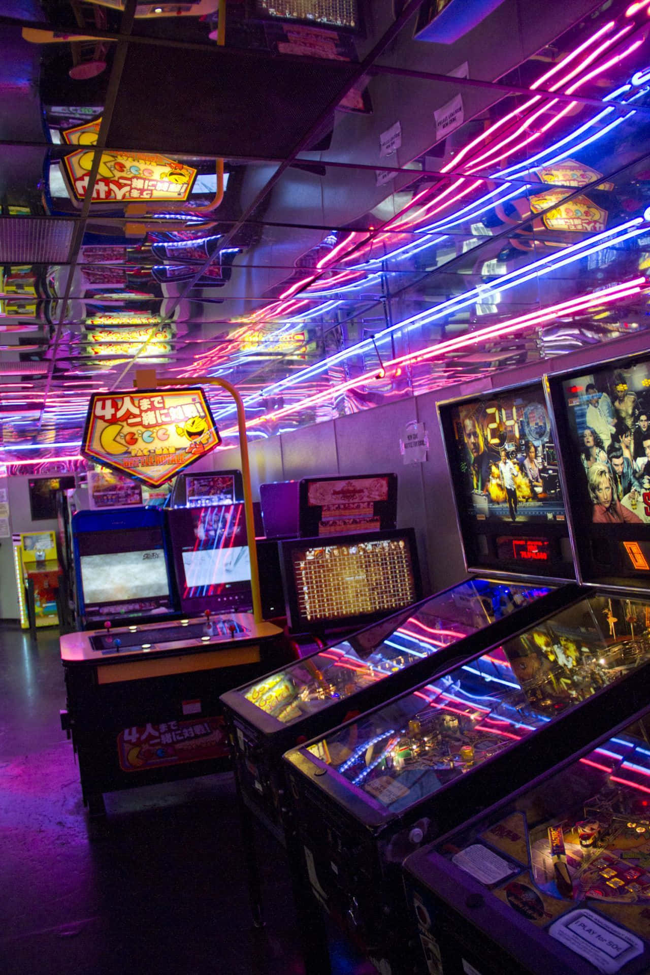 A Room Full Of Pinball Machines Background