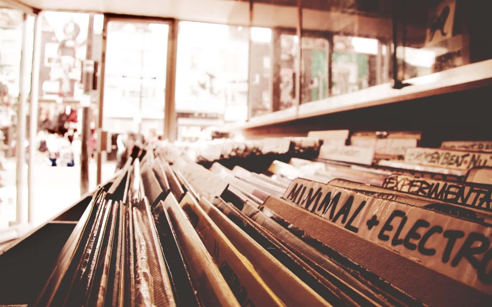 A Row Of Records In A Store Background