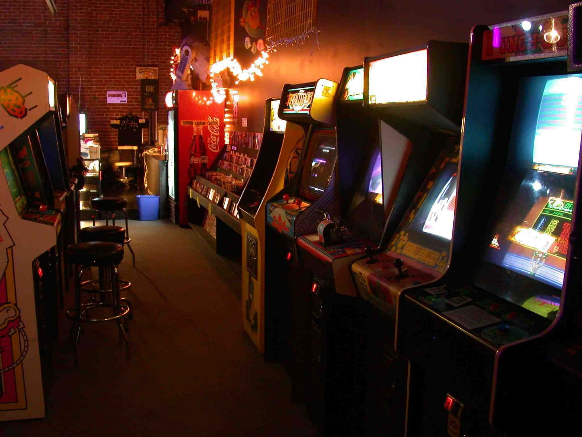 A Row Of Video Game Machines Background