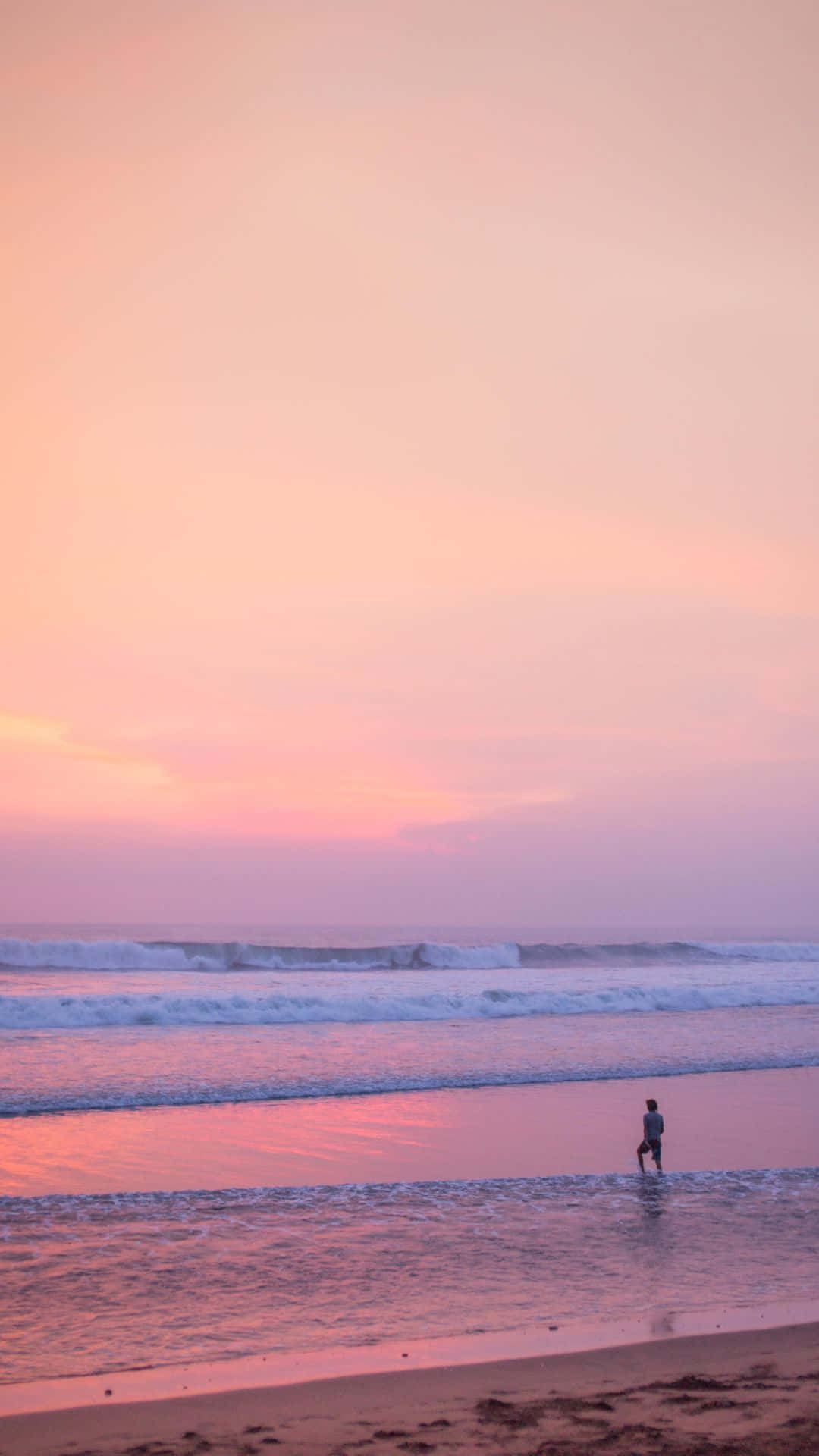 A Serene Afternoon At The Stunning Pink Beach Background