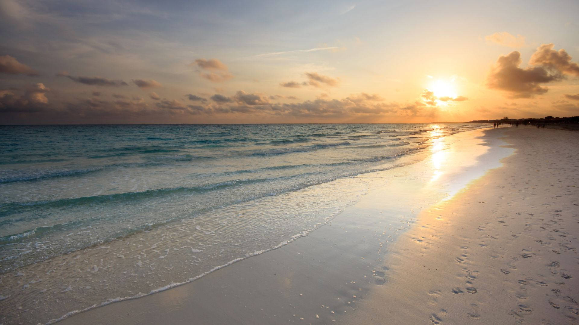 A Serene Beach Sunrise Background