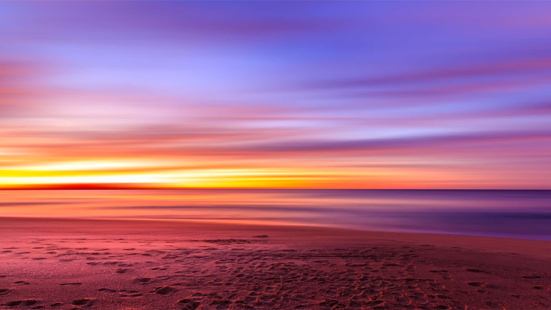 A Serene Beachscape At Sunset Background