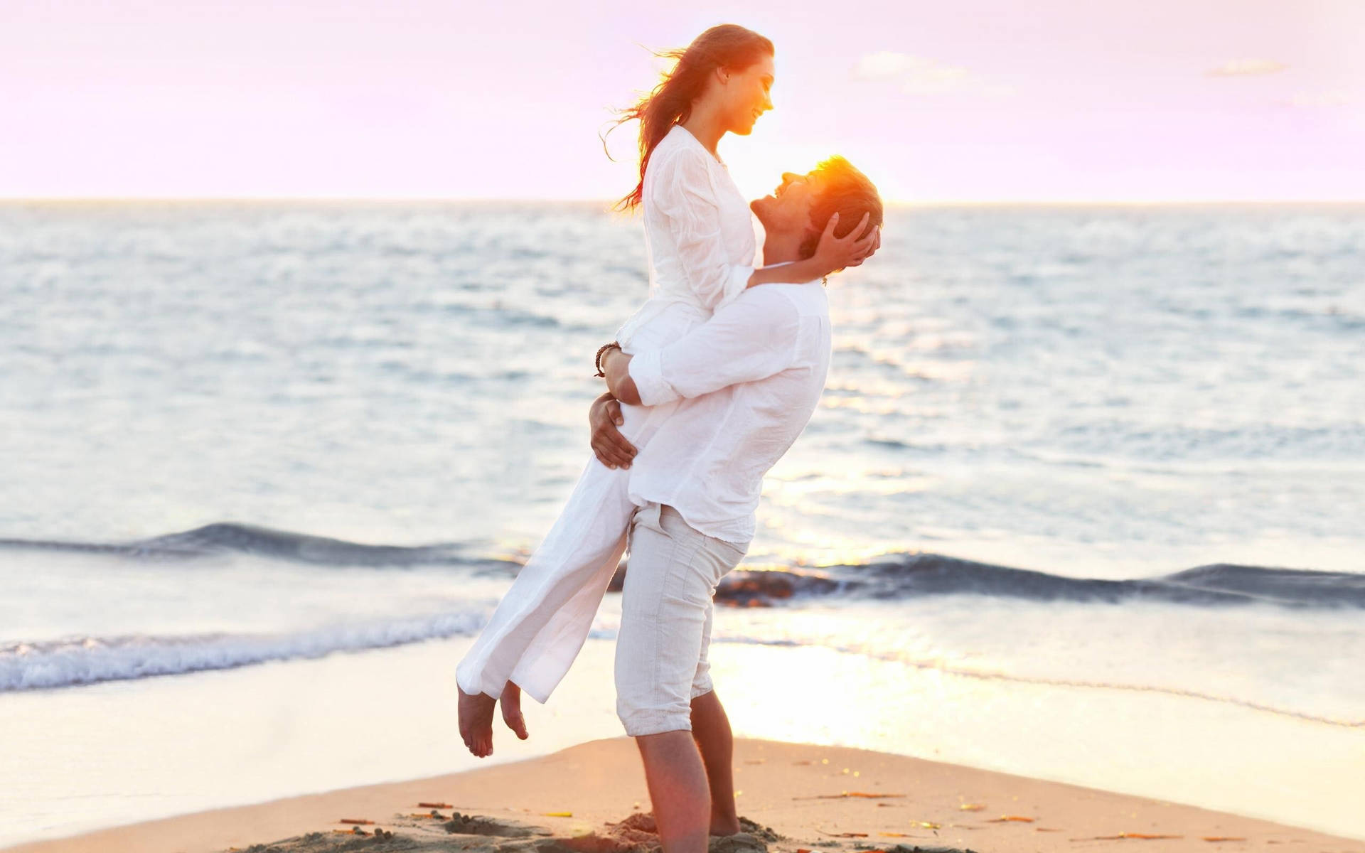 A Serene Moment Of Love At The Beach Background