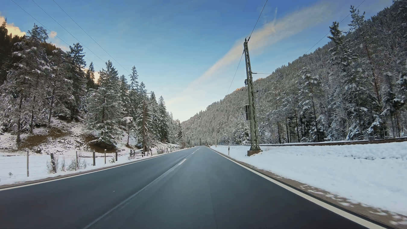 A Serene Snowy Landscape In The Winter Background