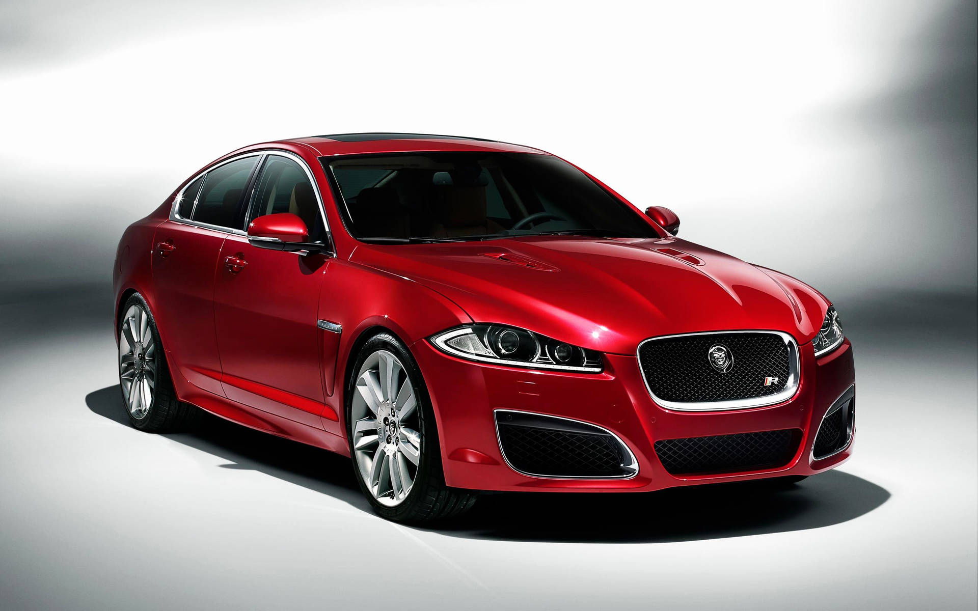 A Sharp And Luxurious Red Jaguar Background