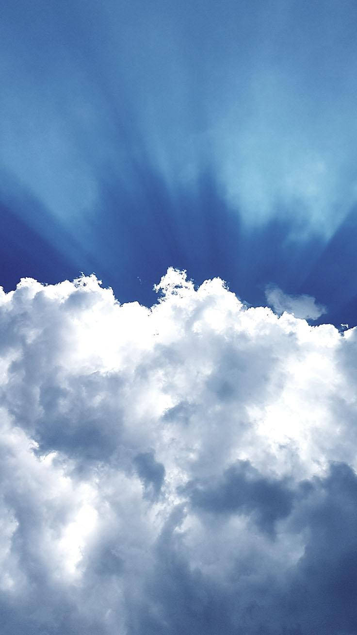 A Shimmering Light Blue Phone Against A Sky Backdrop Background