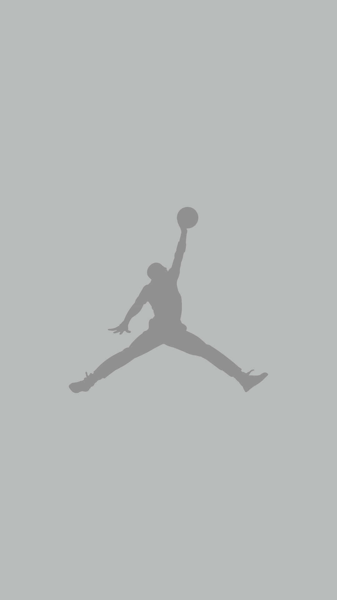 A Silhouette Of A Basketball Player Jumping In The Air Background