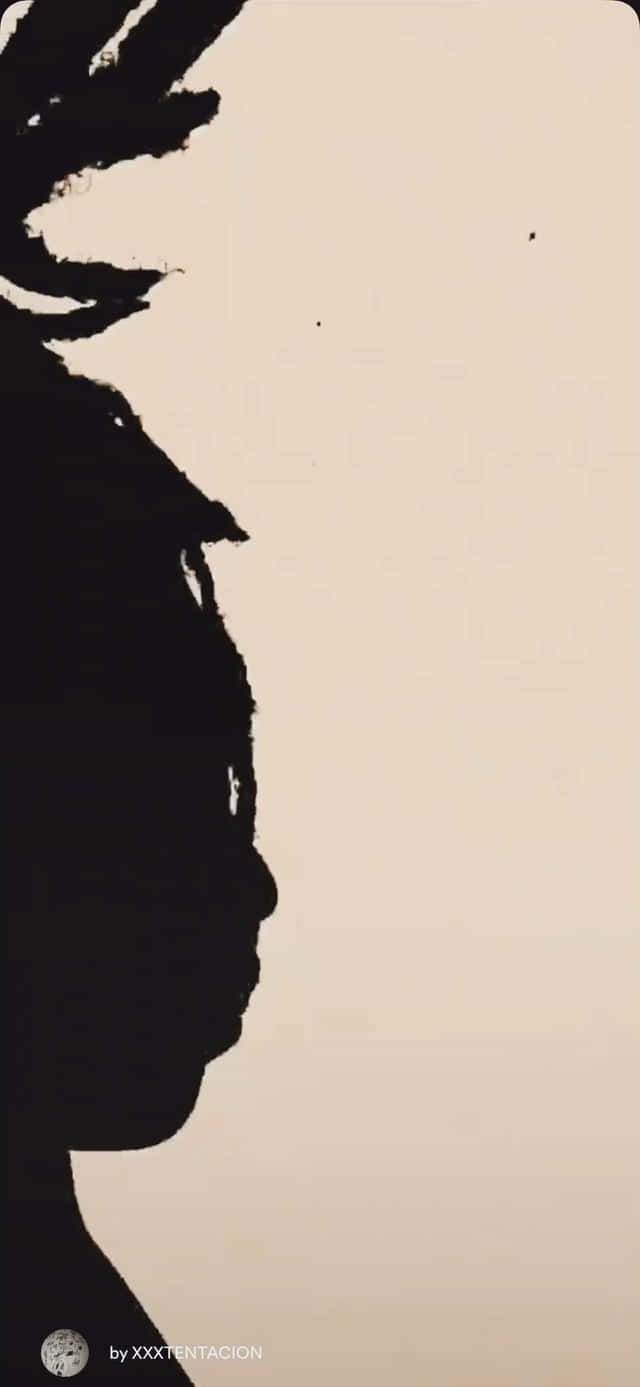 A Silhouette Of A Person With Dreadlocks