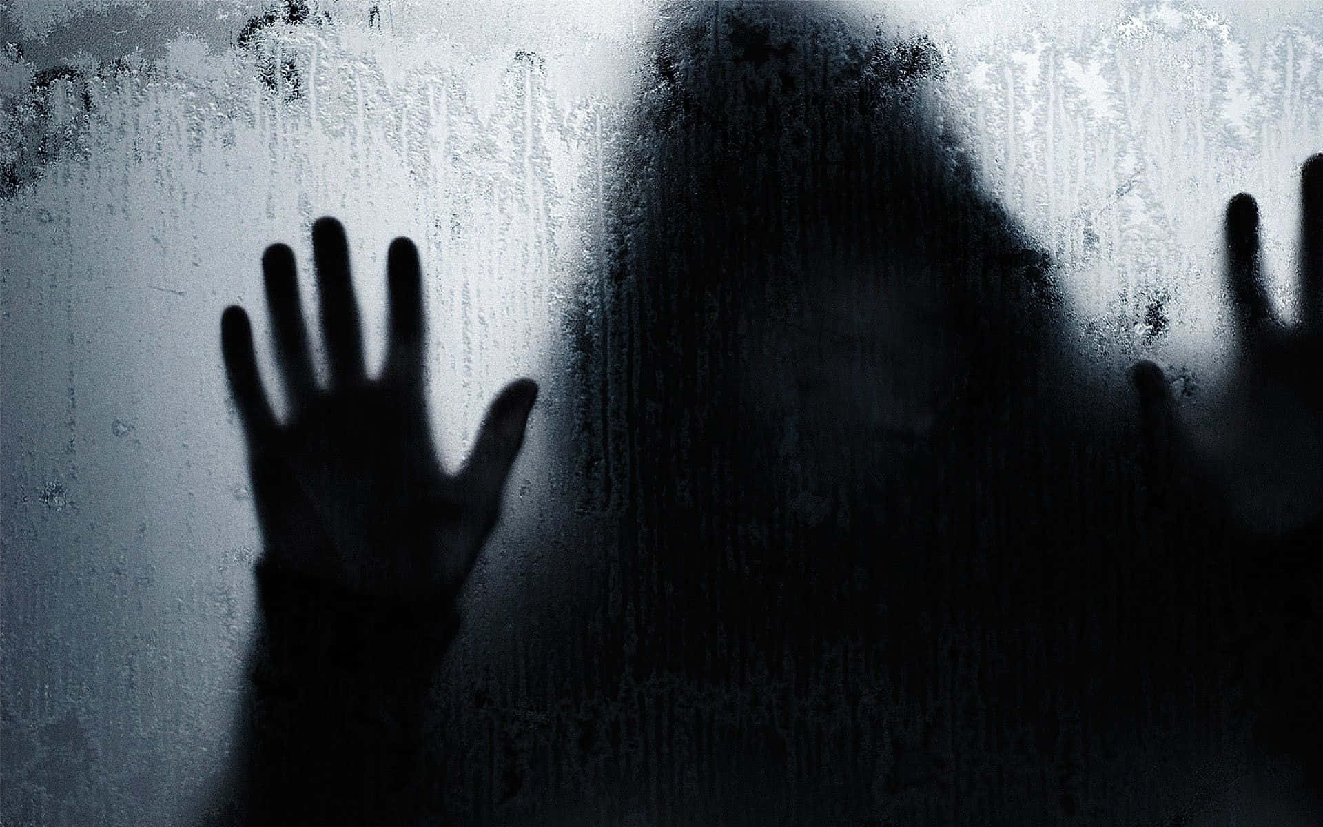 A Silhouette Of A Person With Hands Out Of The Window Background