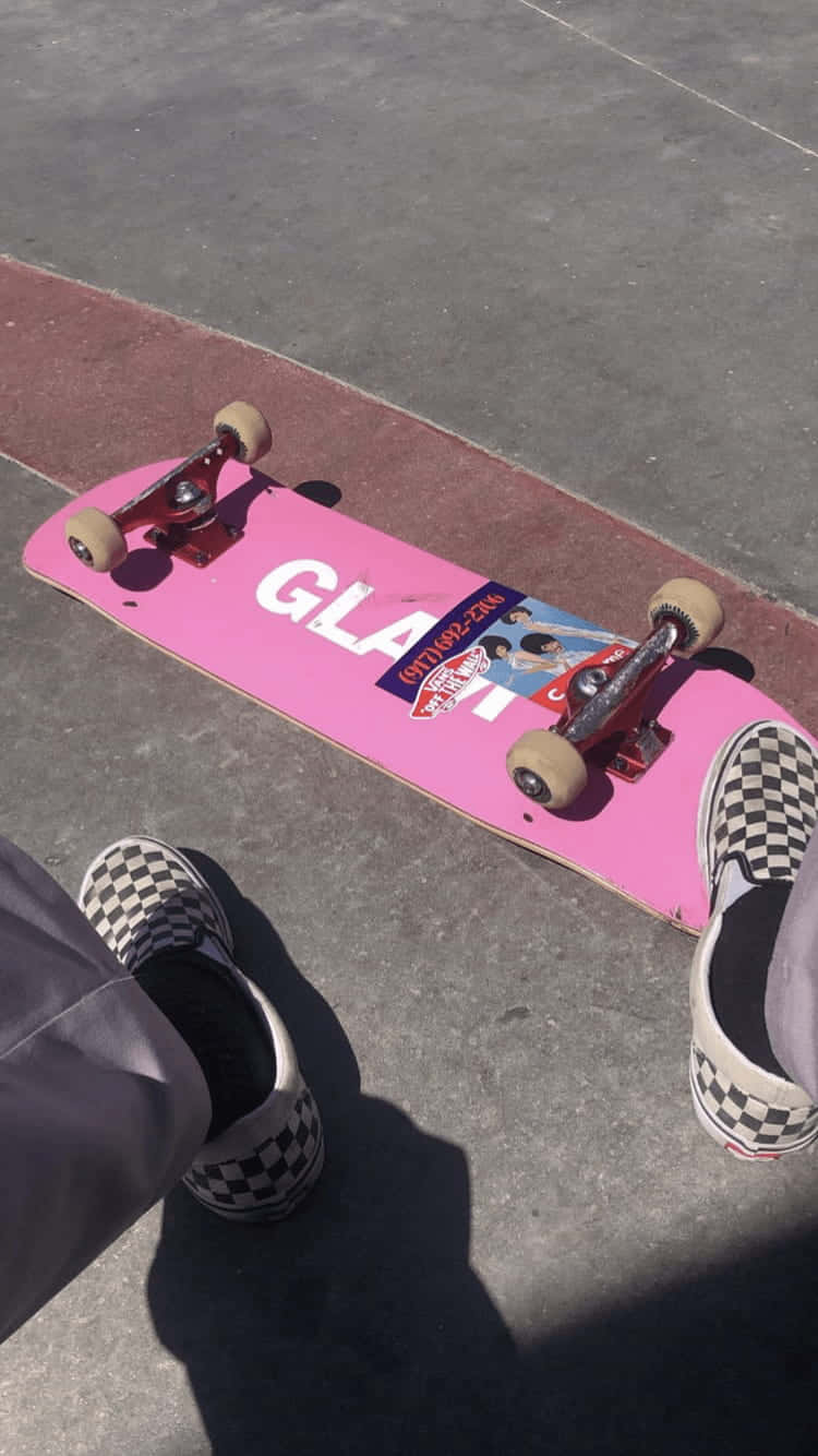 A Silhouette Of A Skater Performing A Kickflip In The Street Background
