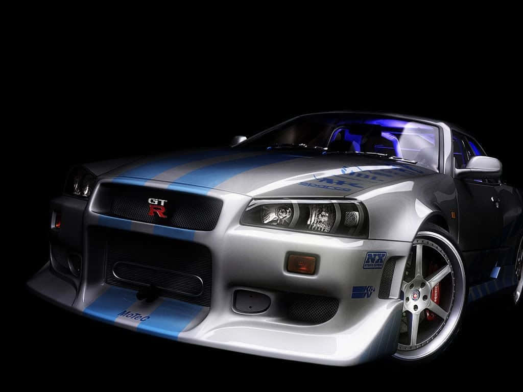 A Silver Sports Car In A Dark Background Background