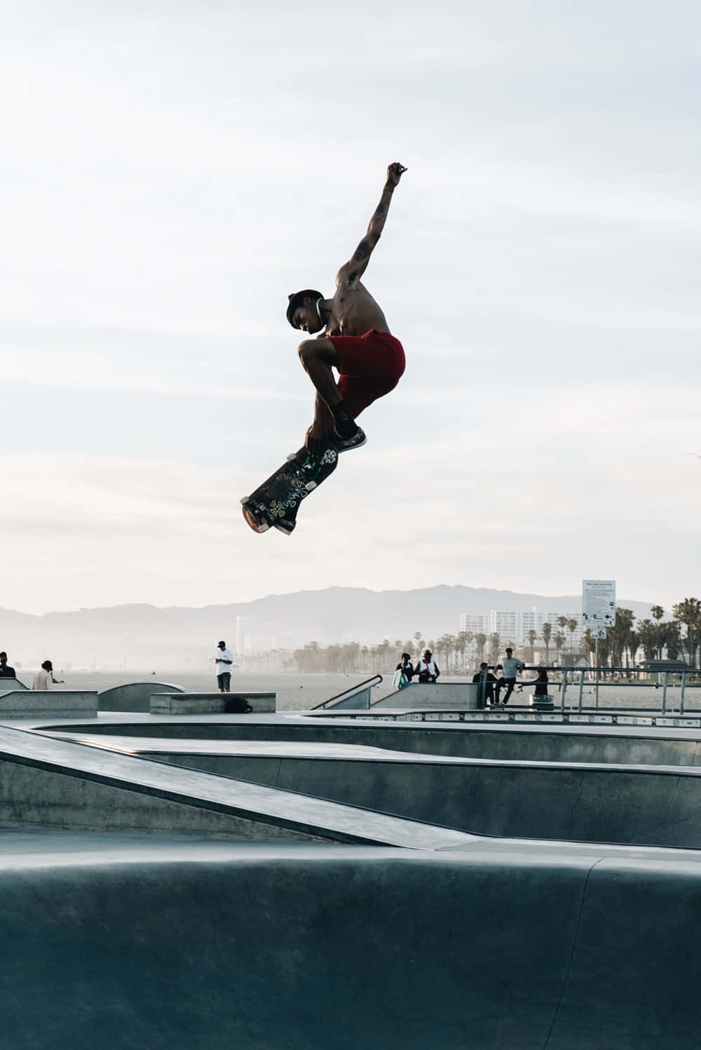 A Skateboarder In The Air Background