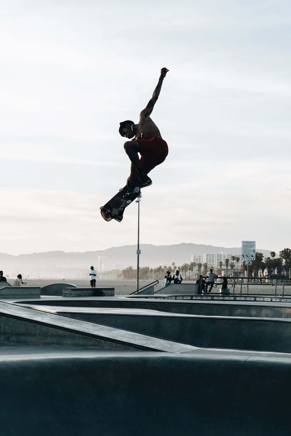 A Skateboarder Performing A Grind On A Rail Background