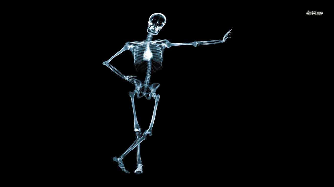 A Skeleton Is Standing On A Black Background