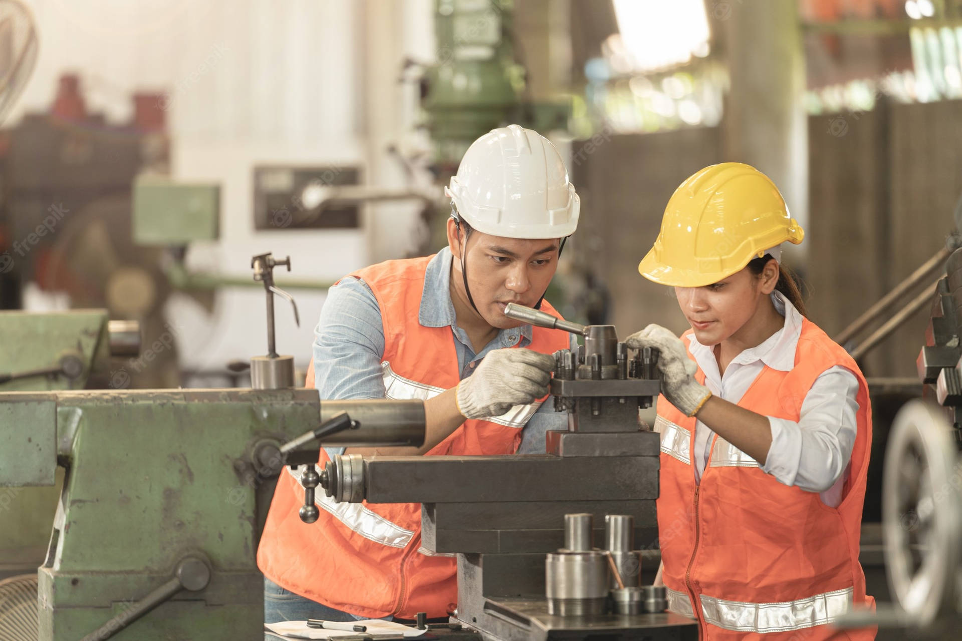 A Skilled Heavy Equipment Operator Hard At Work Against The Industrial Backdrop. Background