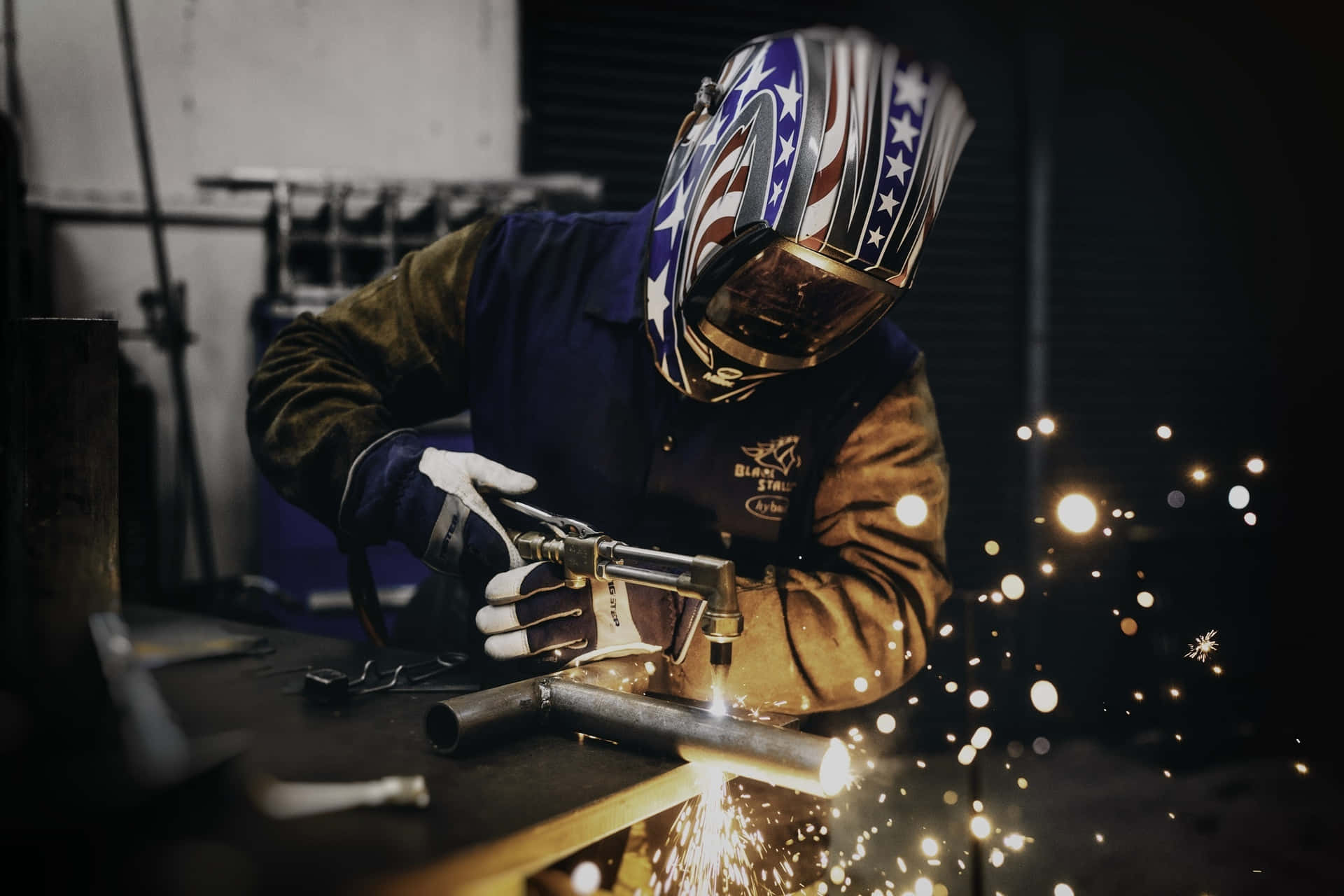 A Skilled Welder Fabricating A Metal Sculpture