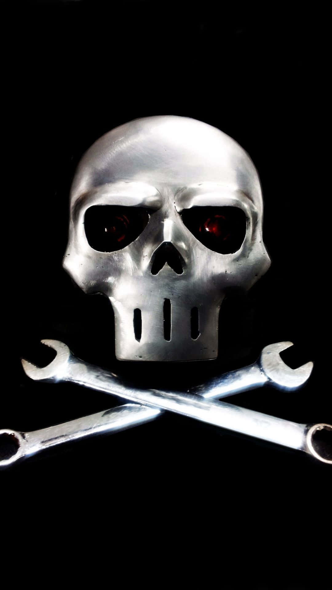 A Skull With Two Wrenches On It Background
