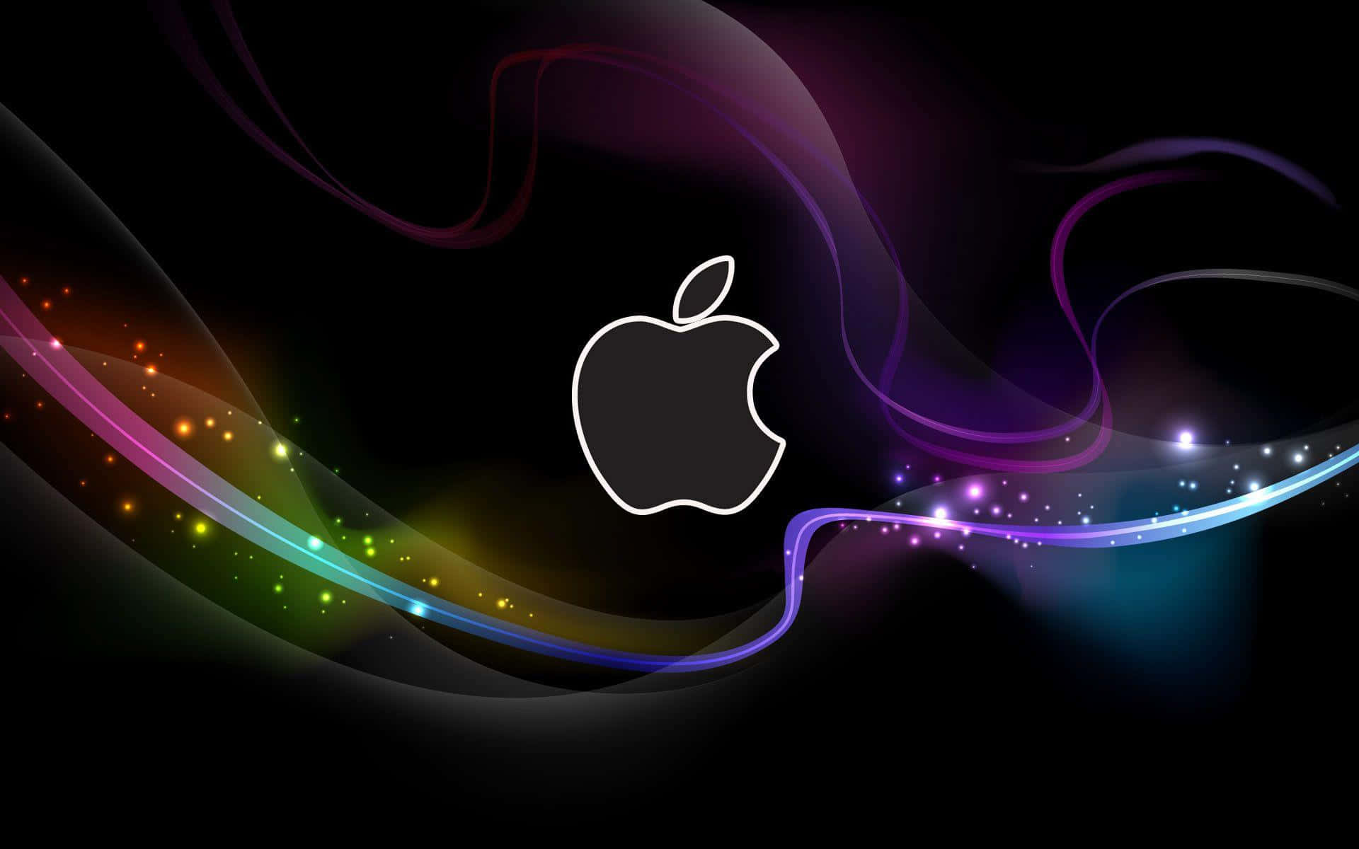 A Sleek Apple Macbook Laptop With A Glowing Backlit Keyboard Background