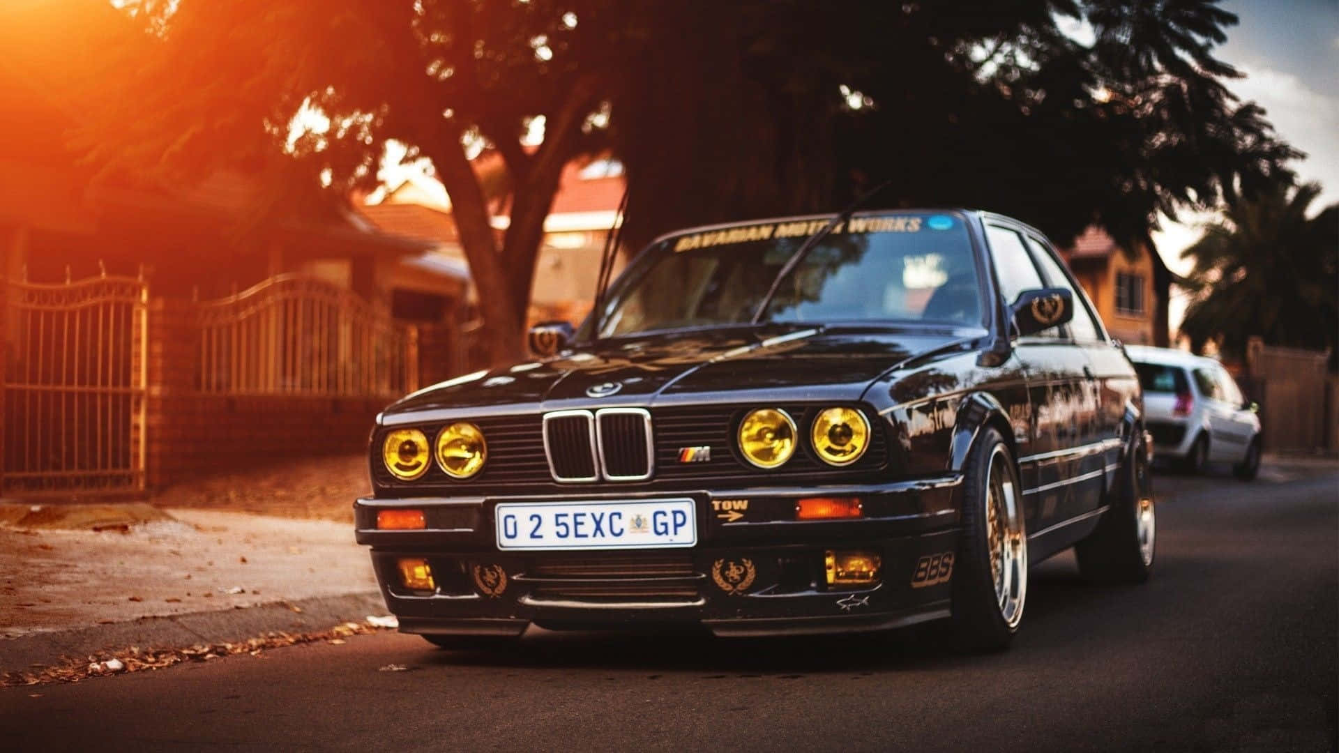 A Sleek Black Bmw In The Evening