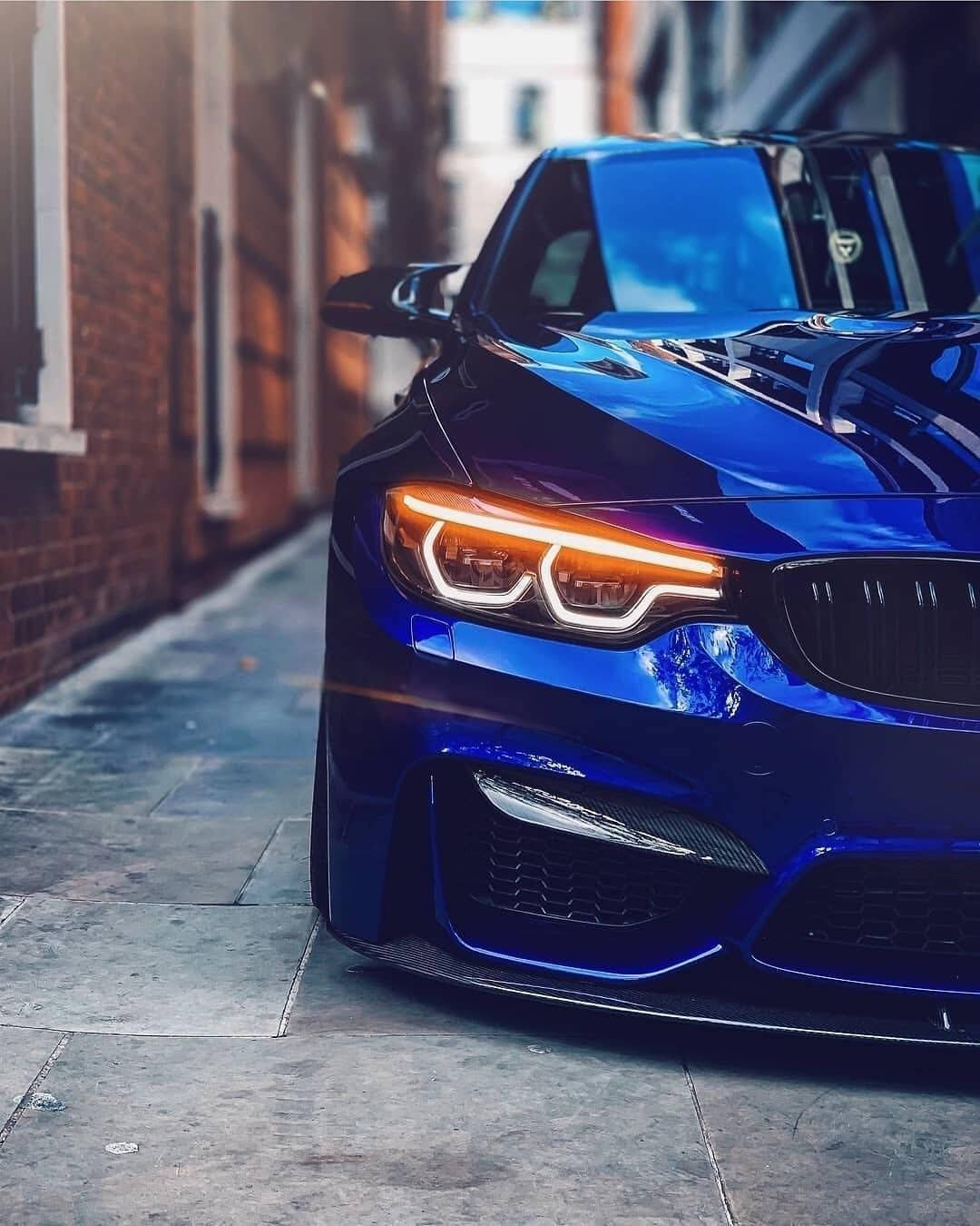 A Sleek Bmw In The Cityscape, With Skyline In The Backdrop. Background