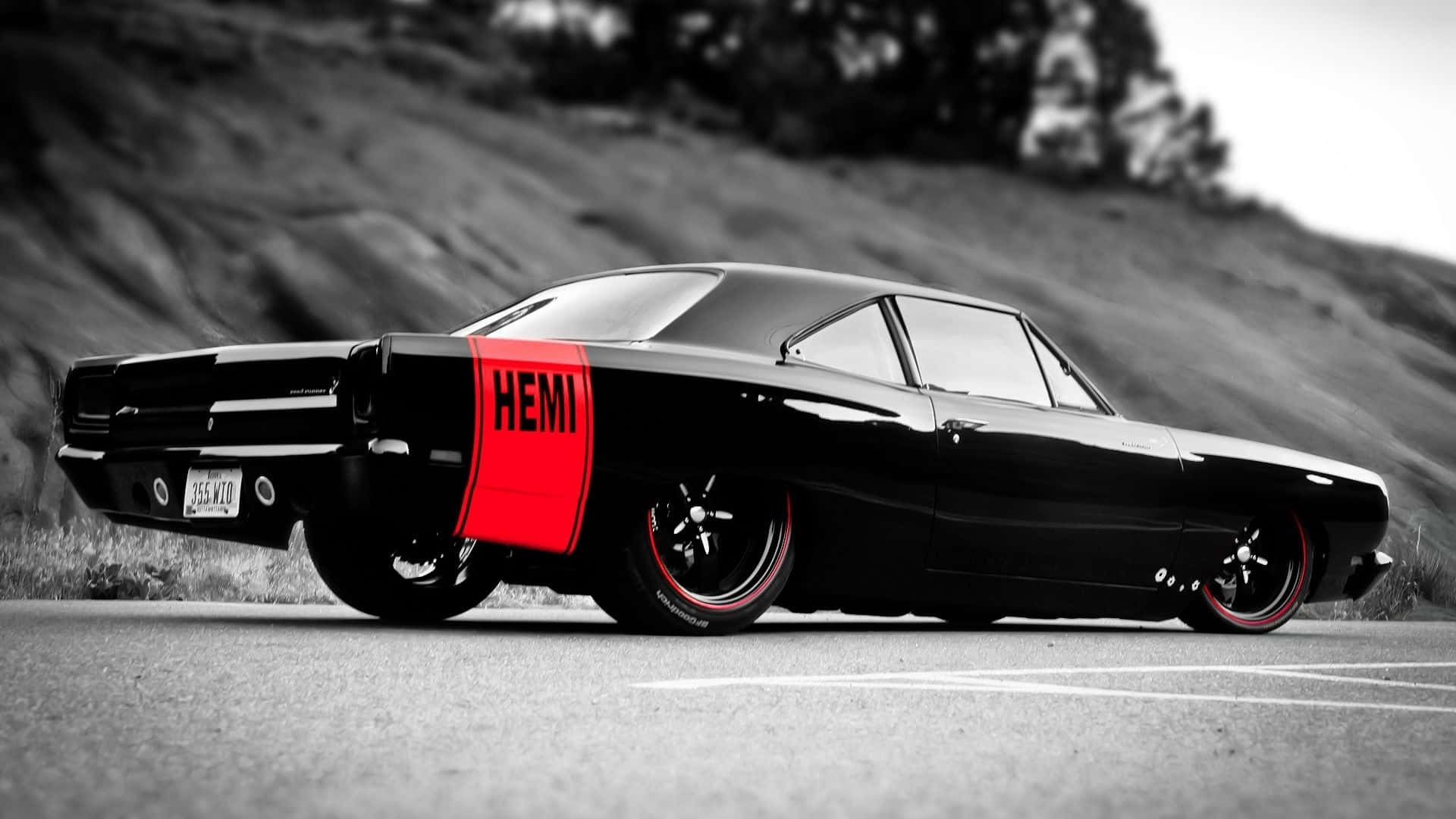 A Sleek Sports Car On A Winding Road Background