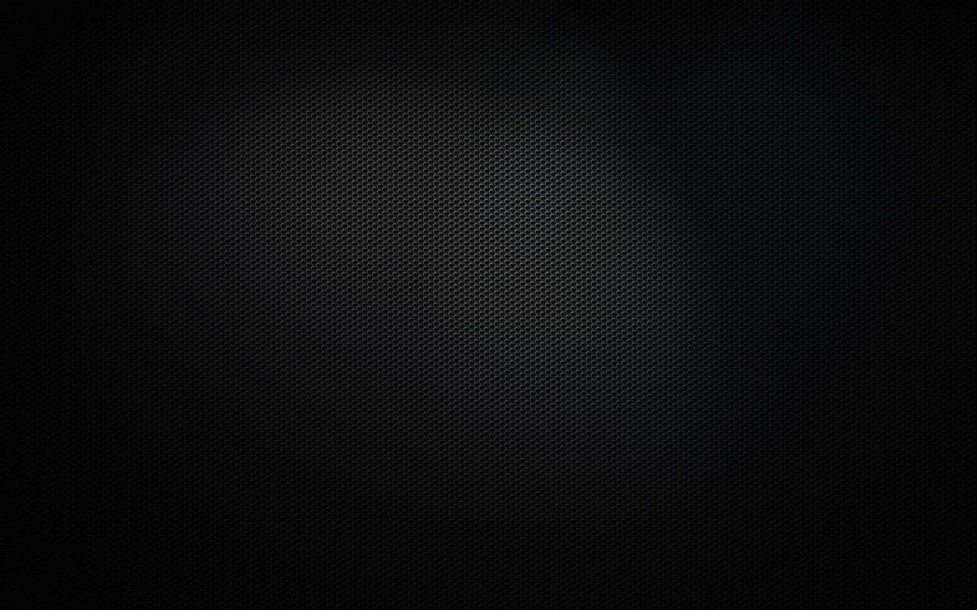 A Sleek Surface Of Black Metal Glitters In The Light. Background