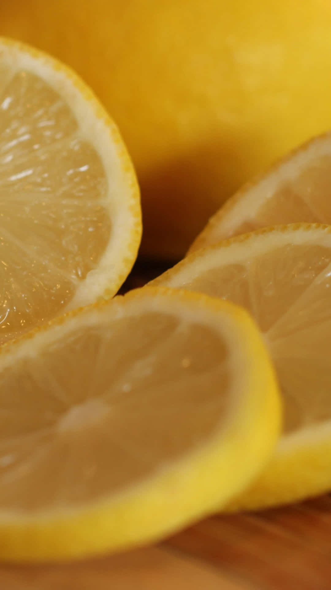 A Slice Of Lemon On A Wooden Cutting Board Background